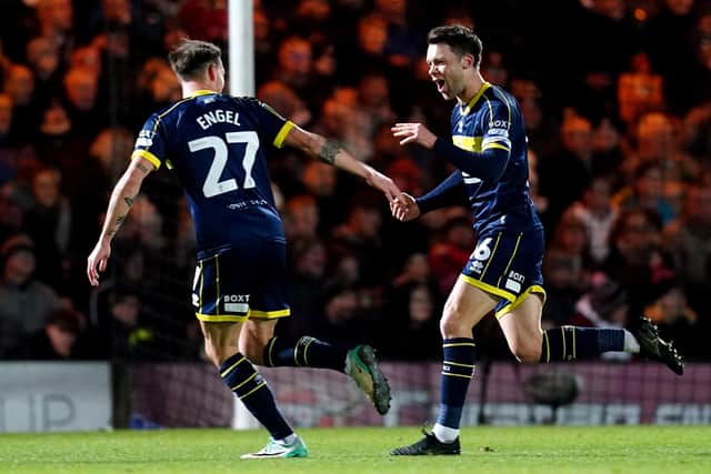 ON TARGET: Middlesbrough's Jonny Howson (right) celebrates scoring their side's first goal of the game during the Carabao Cup quarter final match at Vale Park. Picture: Nick Potts/PA