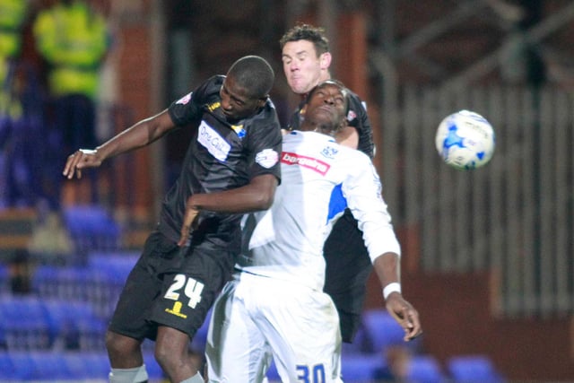 Daniel Carr and Lee Beevers combine to stop Tranmere's Armand Gnanduillet.