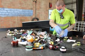 Staff at MYGroup sort through cosmetics to be recycled.