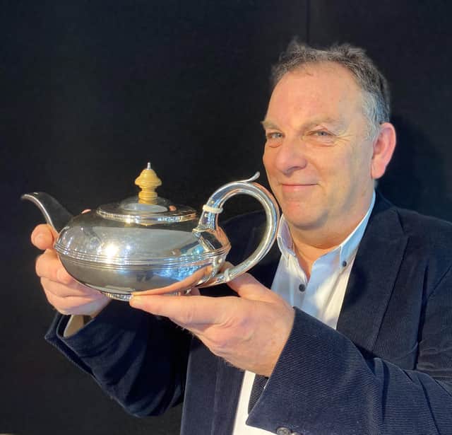 Mike Wilson with a rare York teapot by James Barber and William North, dated 1838