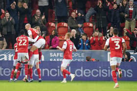 IMPRESSIVE: Rotherham United players leap on Ollie Rathbone after he scored their second goal