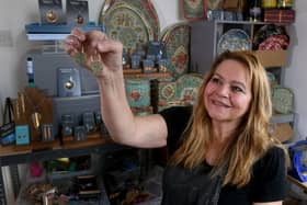 Nancy Jones creates beautiful drop earrings and pendants from vintage tins pictured in her studio at Thornton Village, Bradford Picture taken by Yorkshire Post Photographer Simon Hulme