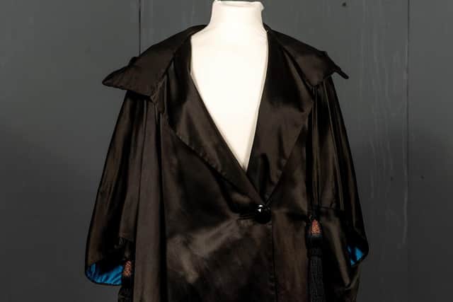 A black 1920s cape, to go under the hammer at the exhibition.