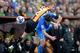 UNSUNG HERO: Bradford City right-back Brad Halliday is challenged by Rob Hunt