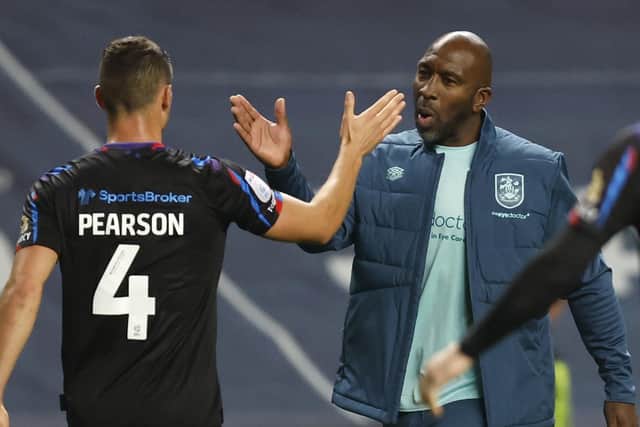 NEW ERA: Huddersfield Town manager Darren Moore shakes hands with Matty Pearson after the Terriers' draw at Coventry City. Picture: Nigel French/PA
