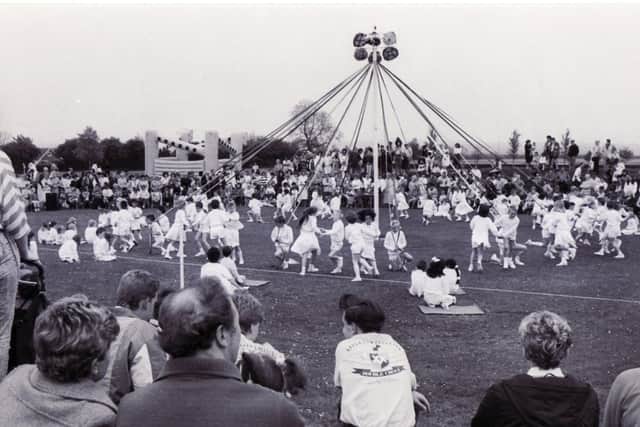 The Maypole dancing gets underway much to the delight of watching parents and friends of pupils at Wadworth First and Middle School - 7 May 1988