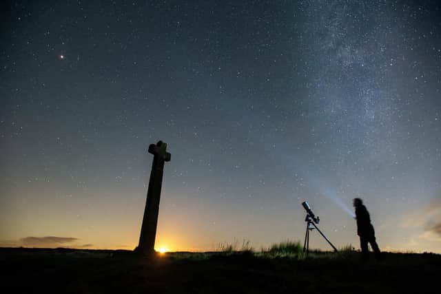 Dark Skies campaigner Richard Darn surveys the night sky as the moon sets at Ralphs Cross, Westerdale on the North Yorkshire Moors. Picture Bruce Rollinson