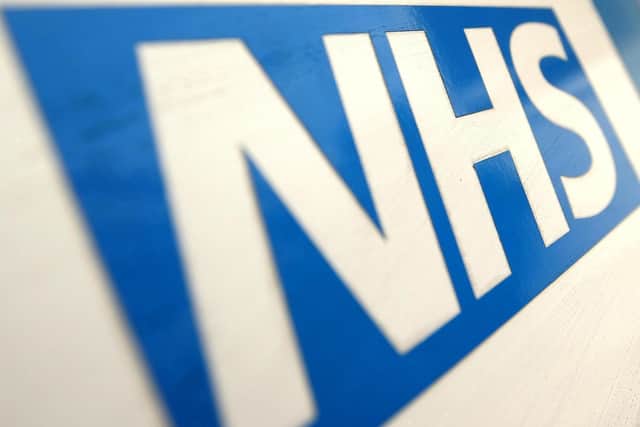 A general view of an NHS logo. PIC: Dominic Lipinski/PA Wire