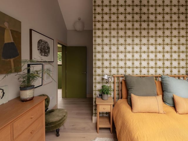 Orla Kiely wallpaper adds colour and character to the bedroom.