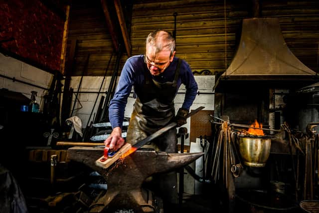 David the Blacksmith working at the forge at museum. Picture By Yorkshire Post Photographer,  James Hardisty