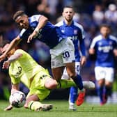 BATTLING: Ipswich Town's Omari Hutchinson is fouled by Huddersfield Town's Tom Edwards at Portman Road Picture: Zac Goodwin/PA