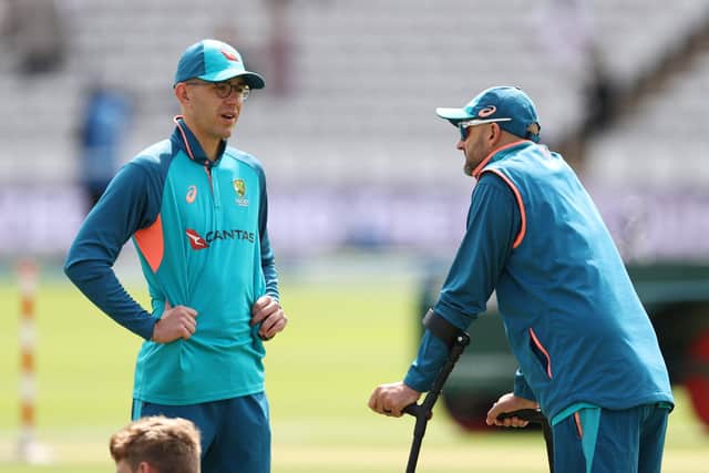 Nathan Lyon of Australia speaks with team-mate and the man to replace him Todd Murphy while on crutches after sustaining an injury on Day Two during warm up prior to Day Three of the LV= Insurance Ashes 2nd Test match between England and Australia at Lord's (Picture: Ryan Pierse/Getty Images)