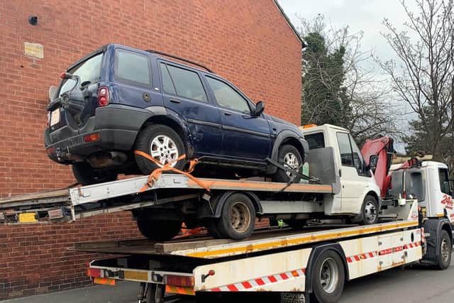 Bungling disqualified driver tried to evade capture by driving onto recovery truck – before both were taken by police