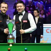 Northern Ireland’s Mark Allen (left) shakes hands with China’s Ding Junhui during day nine of the Cazoo UK Snooker Championship at the York Barbican in 2022.
