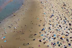 A view of a busy beach following a record-breaking September heatwave this year. PIC: Gareth Fuller/PA Wire