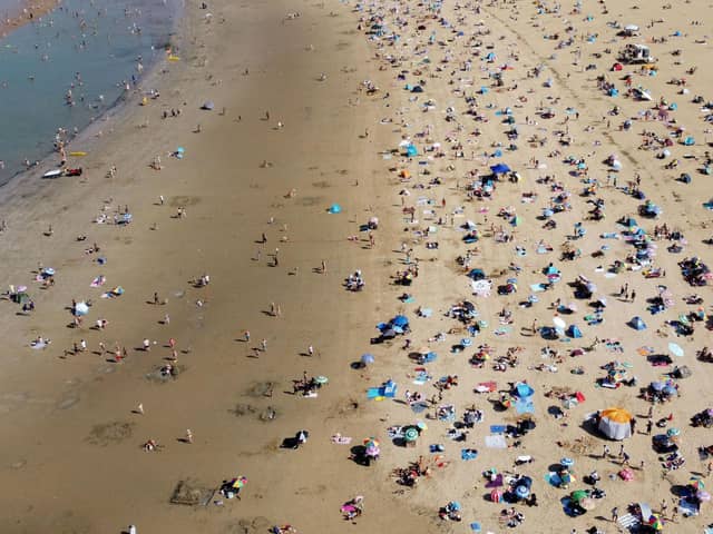 A view of a busy beach following a record-breaking September heatwave this year. PIC: Gareth Fuller/PA Wire
