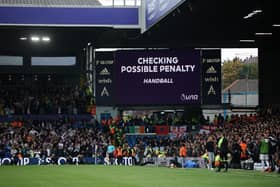 LEEDS, ENGLAND - OCTOBER 16: The LED board shows the VAR screen checking for a possible penalty during the Premier League match between Leeds United and Arsenal FC at Elland Road on October 16, 2022 in Leeds, England. (Photo by Eddie Keogh/Getty Images)