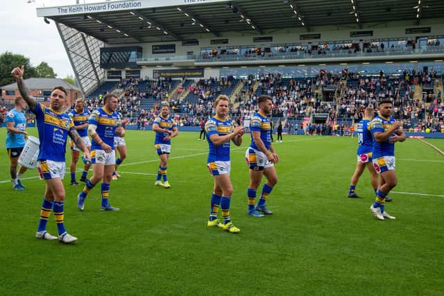 Leeds Rhinos celebrate at full-time. (Picture: Bruce Rollinson/SWpix.com)