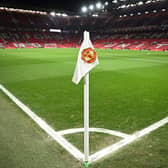 A Manchester United flag is pictured on the corner of the pitch prior to the start of the English Premier League football match between Manchester United and Leeds United at Old Trafford in Manchester, north west England, on February  8, 2023. (Photo by OLI SCARFF/AFP via Getty Images)