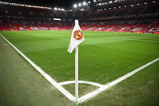 A Manchester United flag is pictured on the corner of the pitch prior to the start of the English Premier League football match between Manchester United and Leeds United at Old Trafford in Manchester, north west England, on February  8, 2023. (Photo by OLI SCARFF/AFP via Getty Images)
