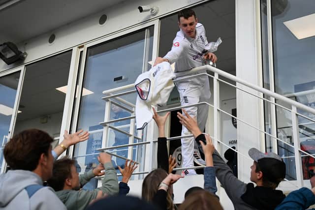 Harry Brook throws some kit to fans after the Ashes series. Photo by Gareth Copley/Getty Images.