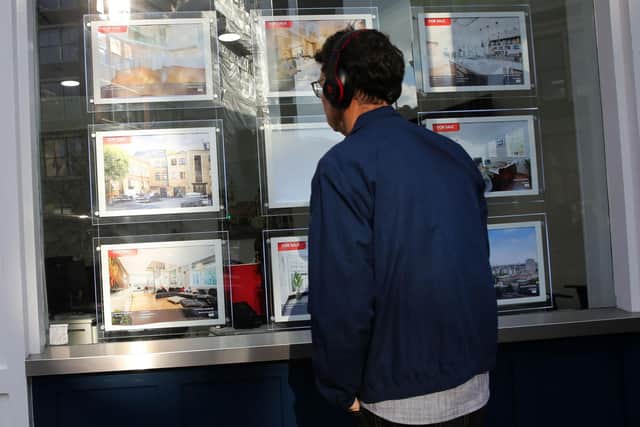 Properties are seen for sale in the window of an Estate Agents in London on September 29, 2022. The plan for top-to-bottom tax cuts, financed by a borrowing spree, have unnerved financial markets, alienated the International Monetary Fund and caused tensions with the Bank of England (BoE). Most immediately for UK voters, it is driving up costs including for home mortgages, as market interest rates surge in the middle of the worst cost-of-living crisis in generations.) (Photo by ISABEL INFANTES/AFP via Getty Images)