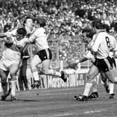Phil Lowe, who has died at 74, was a legend of Hull Kingston Rovers during its glory years and part of the last Great Britain team to win the Rugby League World Cup. Pictured is Lowe being tackled by Andy Gregory (left) and Keith Bentley of Windes during the Rugby League Challenge Cup Final at Wembley. Windes beat Hull Kingston Rovers 18-9.