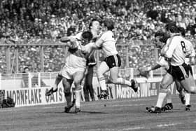 Phil Lowe, who has died at 74, was a legend of Hull Kingston Rovers during its glory years and part of the last Great Britain team to win the Rugby League World Cup. Pictured is Lowe being tackled by Andy Gregory (left) and Keith Bentley of Windes during the Rugby League Challenge Cup Final at Wembley. Windes beat Hull Kingston Rovers 18-9.