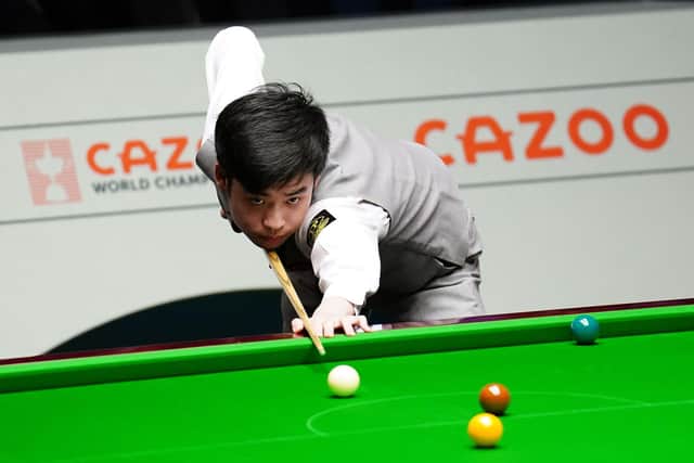 Si Jiahui in action against Luca Brecel (not pictured) on day thirteen of the Cazoo World Snooker Championship at the Crucible Theatre, Sheffield. Picture date: Thursday April 27, 2023. PA Photo. See PA Story SNOOKER World. Photo credit should read: Zac Goodwin/PA Wire.RESTRICTIONS: Use subject to restrictions. Editorial use only, no commercial use without prior consent from rights holder.