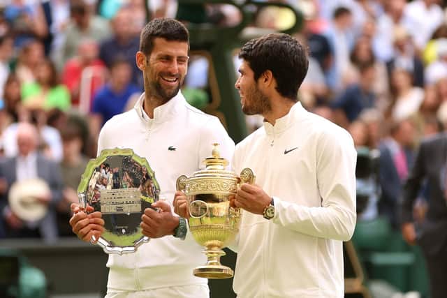 Changing of the guard: Novak Djokovic of Serbia (L) with the Men's Singles Runner's Up Plate alongside Carlos Alcaraz of Spain (R) and the Men's Singles Trophy following the Wimbledon final. (Picture: Clive Brunskill/Getty Images)
