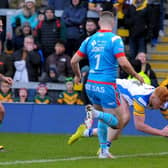 OVER THE LINE: Luis Roberts scores a try for Leeds Rhinos against Wakefield Trinity. Picture: Steve Riding