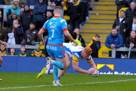 OVER THE LINE: Luis Roberts scores a try for Leeds Rhinos against Wakefield Trinity. Picture: Steve Riding