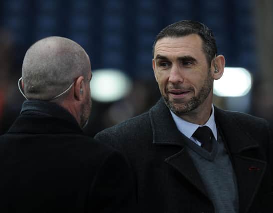 WEST BROMWICH, ENGLAND - NOVEMBER 29:  Former Arsenal player Martin Keown chats to Steve Clarke, former WBA manager before the match between West Bromwich Albion and Arsenal in the Barclays Premier League at The Hawthorns on November 29, 2014 in West Bromwich, England.  (Photo by David Price/Arsenal FC via Getty Images)
