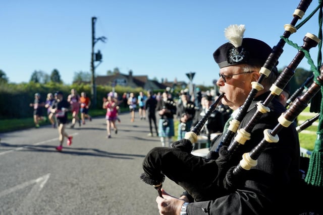 Runners are cheered on by bagpipe players at the Yorkshire Marathon in York this weekend. Picture by SD Photos