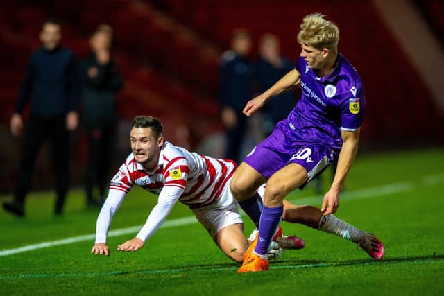 Luke Molyneux is pushed off the ball by Saxon Earley in the reverse fixture between Doncaster Rovers and Stevenage in October. Picture: Bruce Rollinson