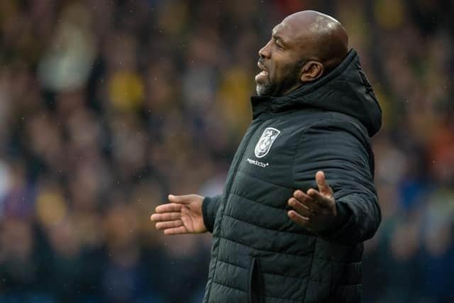 Huddersfield Town boss Darren Moore, who welcomes back four players for Saturday's game at Yorkshire rivals Hull City.