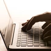 A person using a laptop. PIC: Dominic Lipinski/PA Wire
