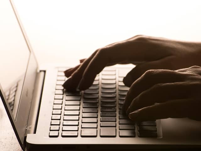 A person using a laptop. PIC: Dominic Lipinski/PA Wire