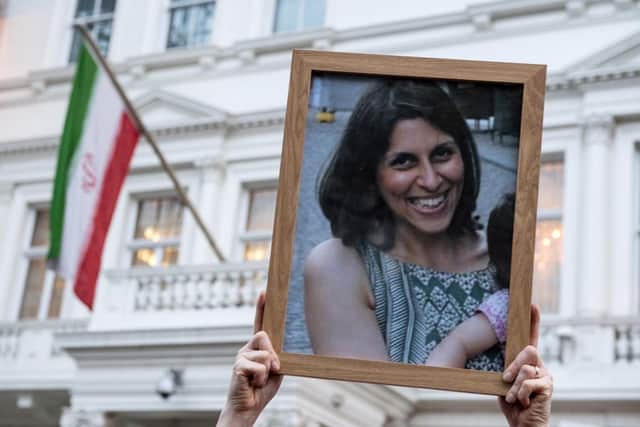 Supporters hold a photo of Nazanin Zaghari-Ratcliffe during a vigil for the mother, who was imprisoned in Tehran outside the Iranian Embassy.  (Pic credit: Chris J Ratcliffe / Getty Images)