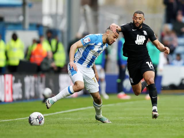 Huddersfield Town's Brodie Spencer battles for possession with Birmingham City's Keshi Anderson during the Sky Bet Championship match at John Smith's Stadium. Photo: Jess Hornby/PA Wire.