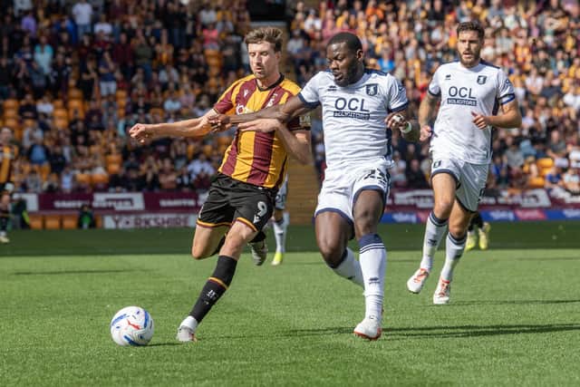 Bradford City's Jake Beesley battles with Mansfield Town's Deji Oshilaja in the hosts' 1-0 League One win at Valley Parade. Photo: Tony Johnson.