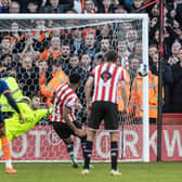 DENIED: Sheffield United's Rhian Brewster hits the post from a penalty kick