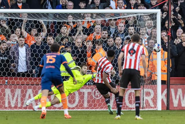 DENIED: Sheffield United's Rhian Brewster hits the post from a penalty kick
