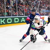 TOUGH NIGHT: Cole Shudra battles for possession with Norway's Max Krogdahl during Monday's Group A clash at Prague Arena. Picture: Dean Woolley.