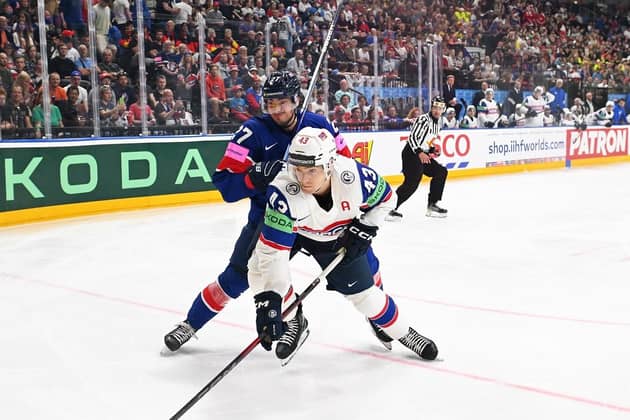 TOUGH NIGHT: Cole Shudra battles for possession with Norway's Max Krogdahl during Monday's Group A clash at Prague Arena. Picture: Dean Woolley.