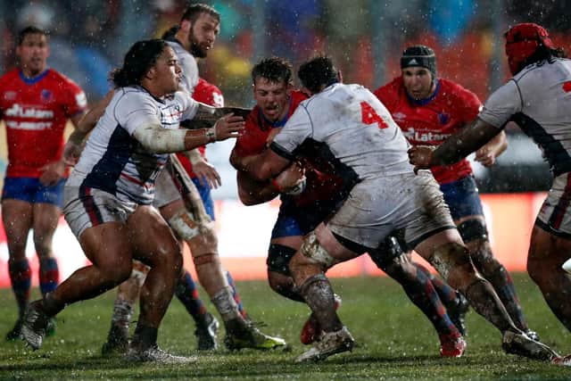 Chile's Martin Sigren (C) is tackled by US Greg Petersen (R) during their Rugby World Cup 2023 Americas 2 play-off first leg match, at the Santa Laura Universidad SEK stadium, in Santiago, on July 9, 2022. (Picture: JAVIER TORRES/AFP via Getty Images)