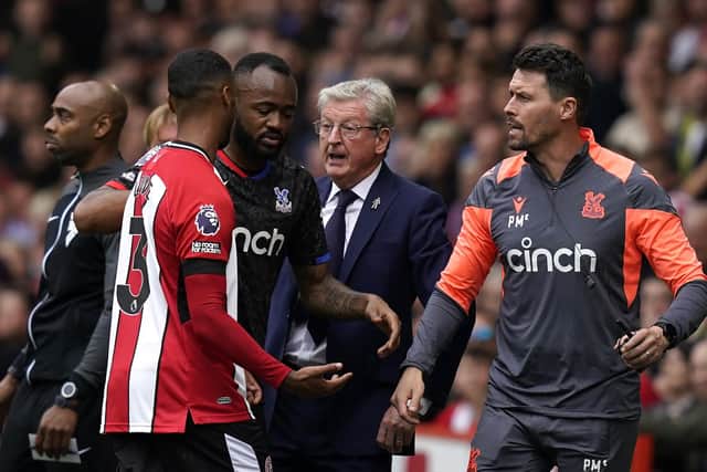 STORM IN A TEACUP: The game briefly gets heated as Max Lowe is overzealous in trying to get the ball back from Crystal Palace manager Roy Hodgson