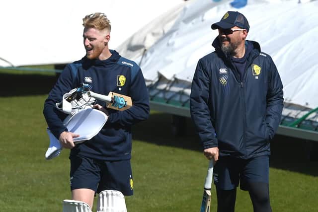 Reunited: England and Durham player Ben Stokes (l) makes his way around the boundary's edge with coach Neil Killeen after a net session during day two of the LV= Insurance County Championship match between Durham and Nottinghamshire at The Riverside on April 22, 2022 in Chester-le-Street, England. (Picture: Stu Forster/Getty Images)