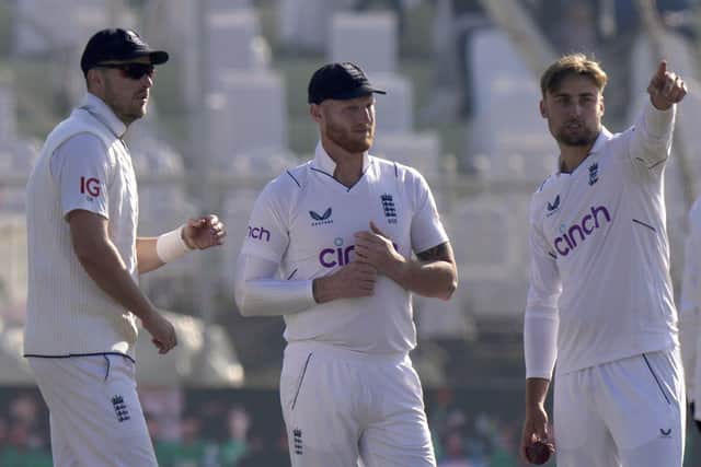 CHANGES: Will Jacks, right, chats with England captain Ben Stokes, center, and Ollie Robinson to adjust his field on day four of the first Test match against Pakistan in Rawalpindi Picture: AP Photo/Anjum Naveed