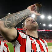 DRINKING IT IN: Sheffield United captain Billy Sharp celebrates promotion with a beer
